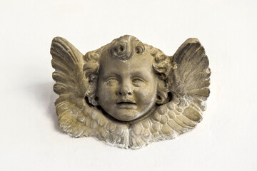 Beautiful angel as a bas relief wall sculpture, details, closeup. Concept of Religion and Religious...