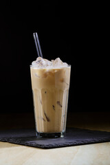 Close-up cold coffee, summer refreshing cocktail with ice