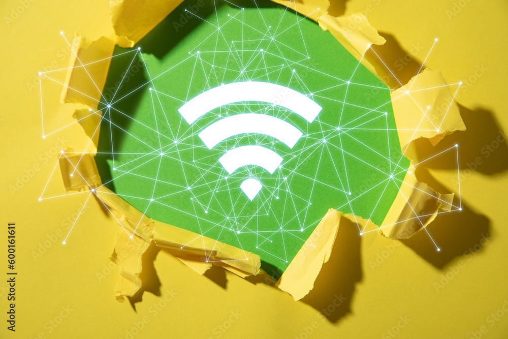 Wall mural torn paper with a wireless technology symbol. wifi symbol with a network connection