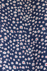 Hanging jute cloth depicting flowers daisies blue background-