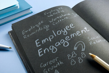 Employee engagement written by pencil and marks about it.