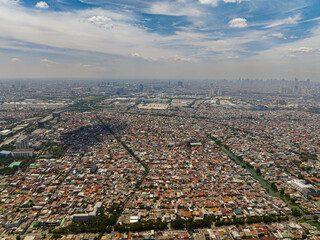 Aerial drone of slums and skyscrapers in Jakarta. City Landscape. Indonesia.