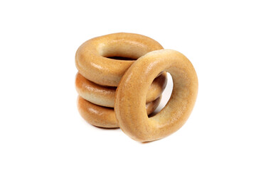 Delicious dry bagels isolated on white