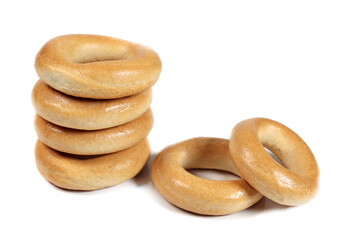 Stack of dry bagels isolated on white