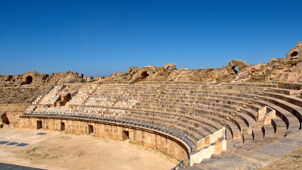 Stadium style seating in the amphitheater in the Roman ruins at Uthina, outside of Tunis, Tunisia