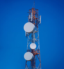 5G Cell Towers for smart mobile telephone on sky background