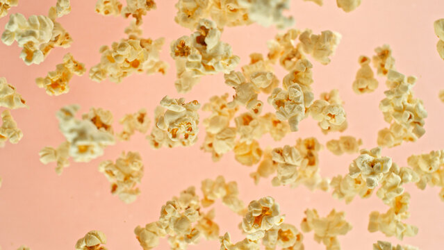 Freeze motion of flying popcorn up in the air.
