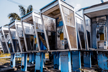 Old and dirty street phones at the city landfill