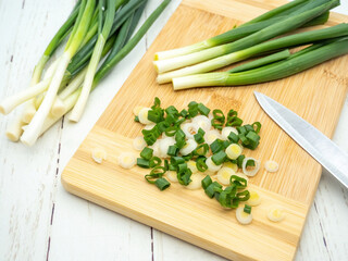 top view of green onion cut on a cutting board