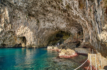Grotta Zinzulusa. View from the cliff to the crystal clear azure Adriatic Sea with transparent...