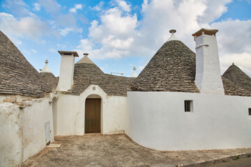 Fototapeta na wymiar traditional Trulli houses in Alberobello city, Apulia, Italy