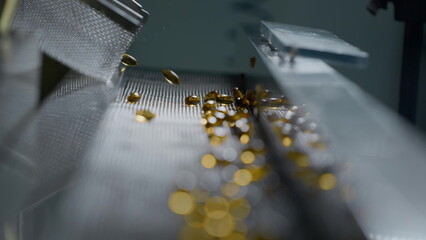 Gelatin capsules in the production of vitamins and medicines. Slow motion