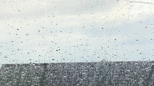 
raindrops splashing on a window