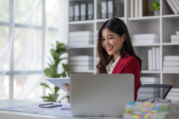 Successful business concept, Businesswoman smiling and using tablet to reading financial report.