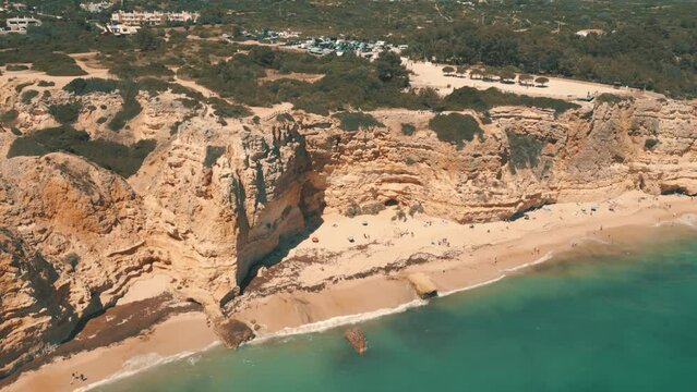 A picturesque sandy beach cove and clear blue water in the Algarve, portugal