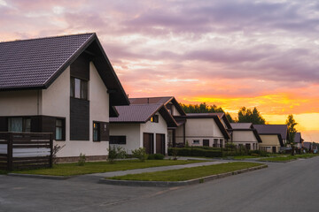 Village houses at sunset in summer. Beautiful view
