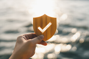 Businessman holding shield protect icon, Security protection and health insurance. The concept of family home, foster care, homeless support, protection, health care day and home school education.