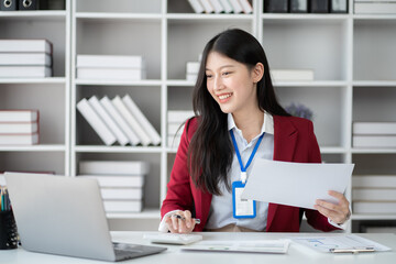Young professional businesswoman working in the office room with laptop computer.