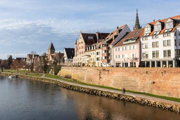 Beautiful old wooden beam houses with white and orange plaster. Fishermen's Quarter. Ulmer Stadtmauer. Fachwerk. Danube River Embankment