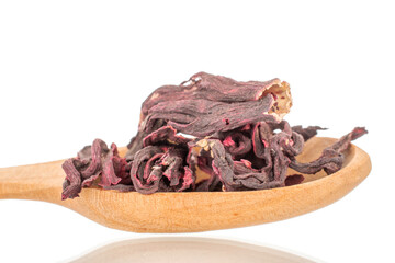 Karkade tea in  wooden spoon, macro, isolated on white background.