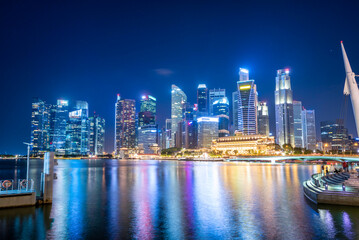 Singapore Skyline and view of skyscrapers on Marina Bay at twilight time.