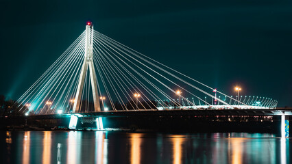 Fototapeta na wymiar Świętokrzyski bridge over Vistula river at night