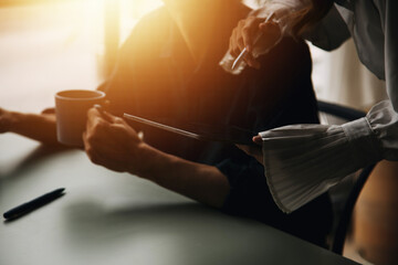 Financial Business team present. Business man hands hold documents with financial statistic stock photo, discussion, and analysis report data the charts and graphs. Finance Financial concept