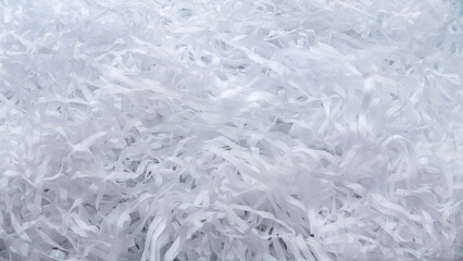 Background of white shredded paper. Paper strips.