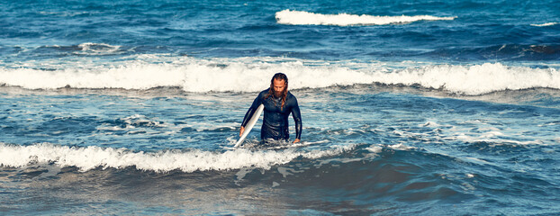 Couple of surfers on the beach