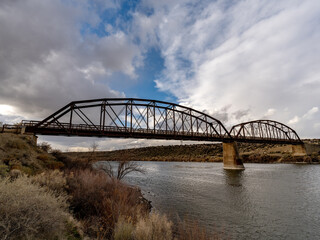 Old metal bridge leading over the Snake River in Idaho