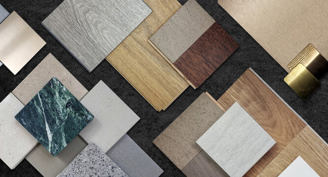 home interior material samples selection contains brushed stainless, metallic laminated, wooden vinyl flooring tiles, laminated tiles, marble stone, stone tiles placed black stone table background.