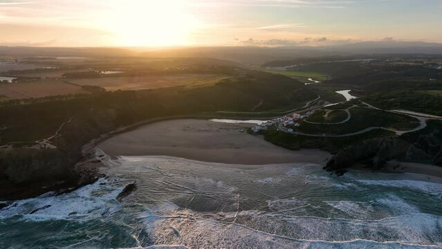 Aerial view of Praia de Odeceixe along Ribeira de Seixe river, Odeceixe, Faro, Portugal.