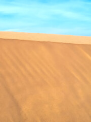 Untouched natural sand dunes with blue sky good for nature background