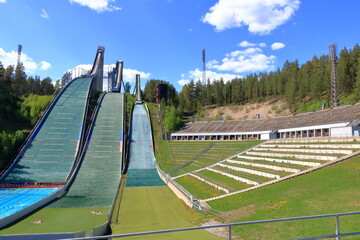 Aerial view of sports centre with three ski jump towers in the summer, Lahti, Finland