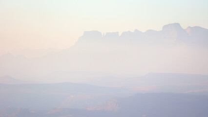 Fototapeta na wymiar Sunrise in the Drakensberg in a soft pastel style