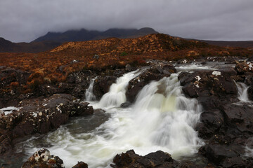 Fast flowing Waterfall at Sligachan on a cludy day. Isle of Skye, Scotland, UK.