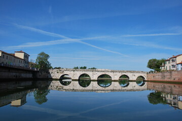 Fototapeta na wymiar The Tiberius bridge in Rimini - Italy (mirror image)