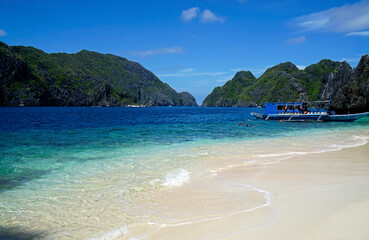traditional wooden outrigger boats on palawan island