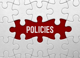 Fototapeta premium Word POLICIES on red puzzle background