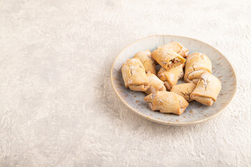 Homemade sweet cookie with apple jam on gray concrete. side view, copy space.
