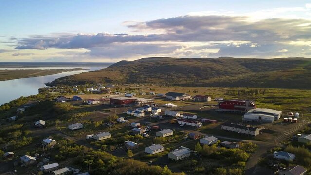Aerial Time Lapse Shot Of Houses In Coastal Town Near Sea, Drone Flying Forward Over Dwelling Against Sky - Bering Sea, Alaska