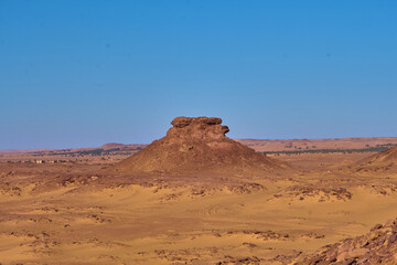 Fototapeta na wymiar mountain, sandy ground and clear sky background