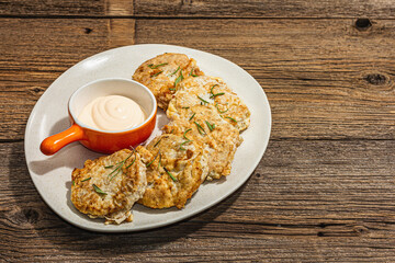 Hake fillet fried in batter. Sauce, fresh rosemary. Vegetarian healthy food concept