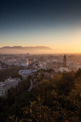 view over Malaga at sunset travel banner