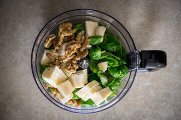Green basil walnut pesto - italian recipe ingredients right before they get blended from above....