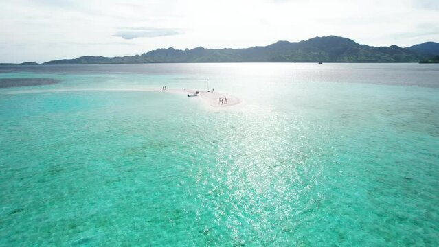 Aerial video on Snake Island Indonesia Aerial view showing boats and tourists enjoying Snake Island