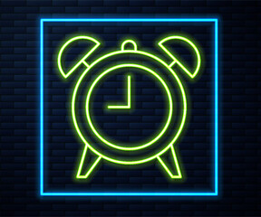 Glowing neon line Alarm clock icon isolated on brick wall background. Wake up, get up concept. Time sign. Vector