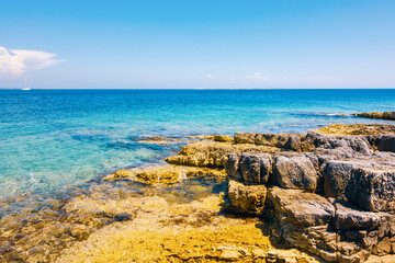 Fototapeta na wymiar Wild tropical blue lagoon beach on a sunny day. Kvarner Bay, Croatia, Europe.