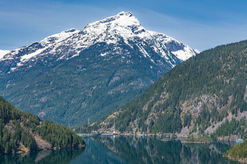 Landscape of Snowcapped Davis Peak with Diablo Lake and Diablo Dam in the Foreground in the North Cascades Mountains and Forest in Whatcom County, Washington, USA