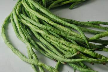 A bunch of raw long beans isolated on a white background